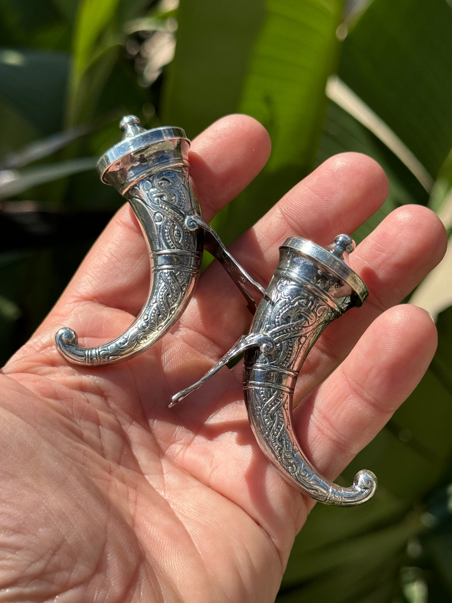 Small sterling silver horn shaped salt and pepper shakers